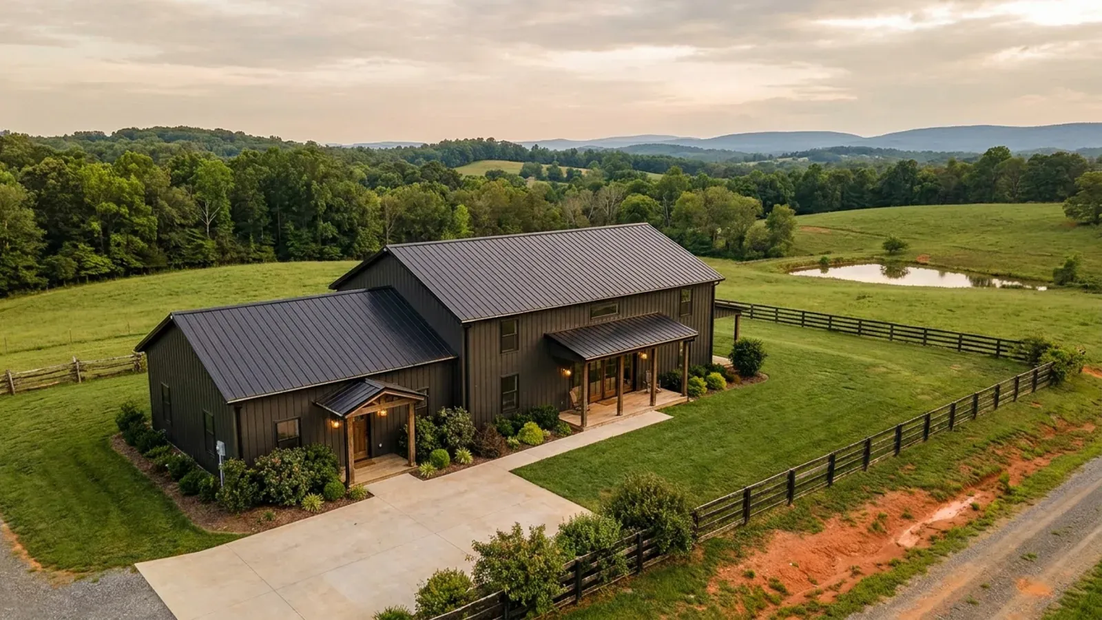 A barndominium with a smaller attached in-law suite wing that has its own separate covered entry, distinct from the main entry.